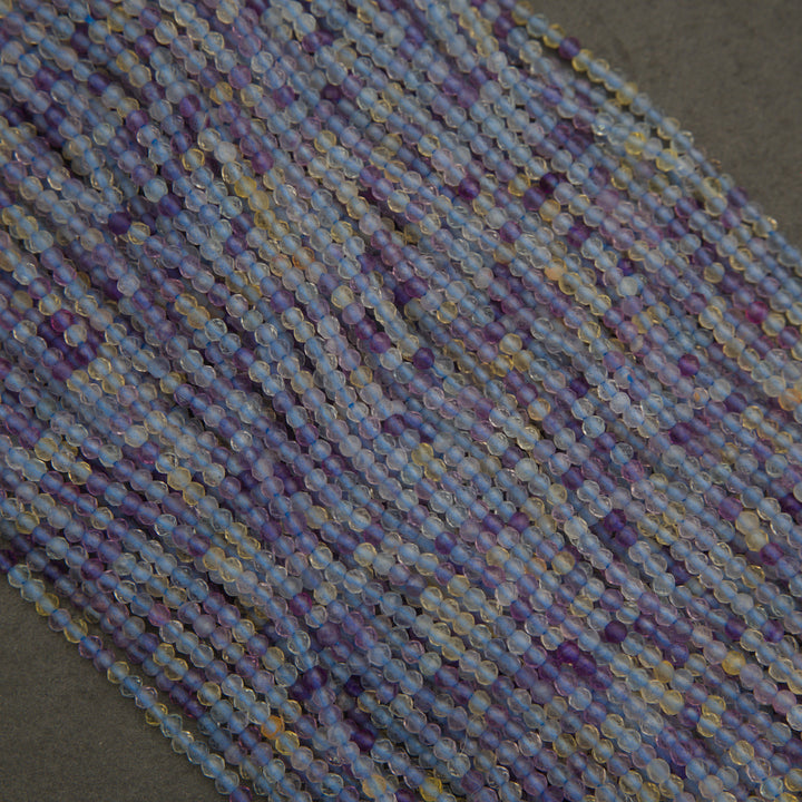 Close-up of a string of multicolored beads on a dark background