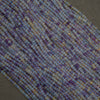 Close-up of a string of multicolored beads on a dark background