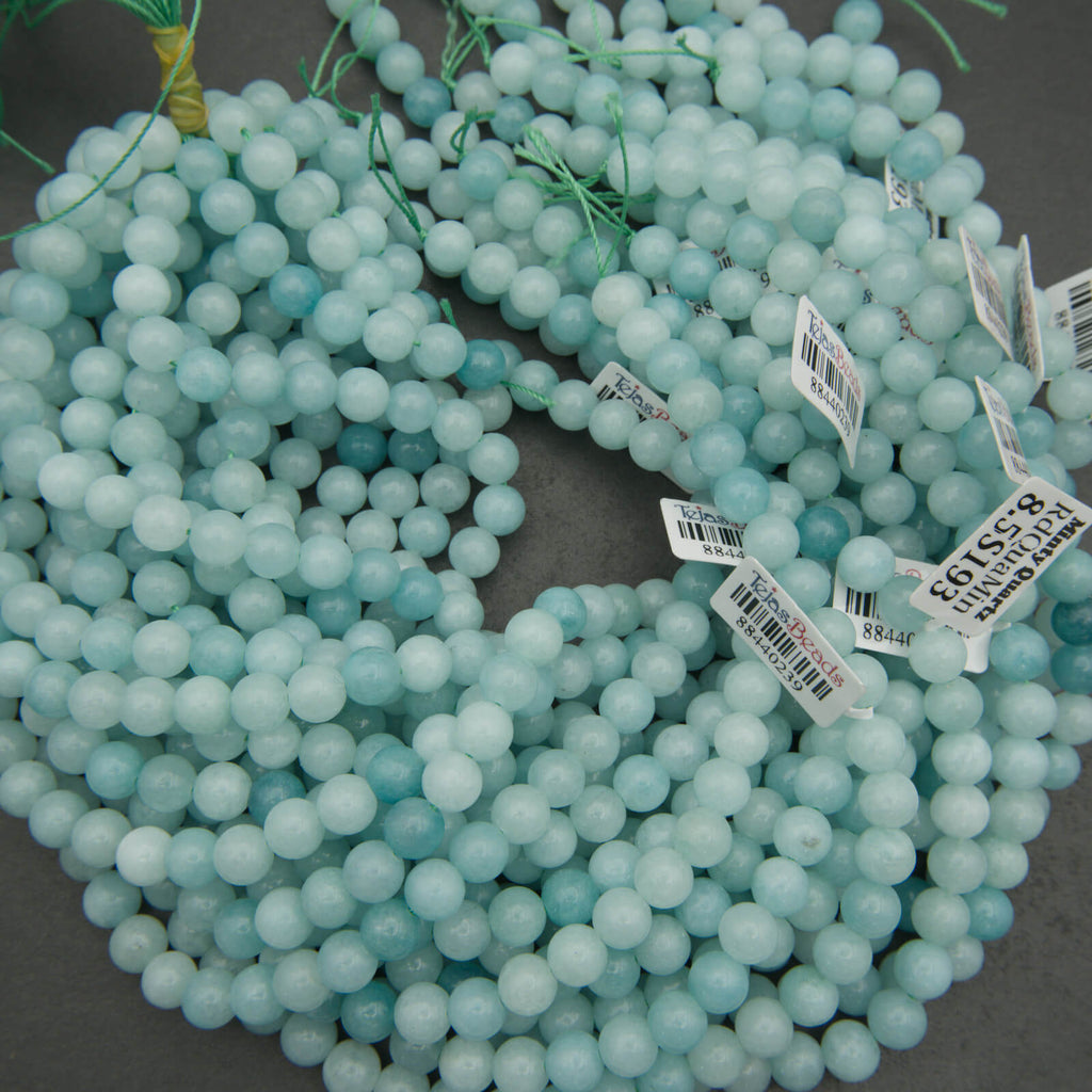 Turquoise beads with price tags on a dark background