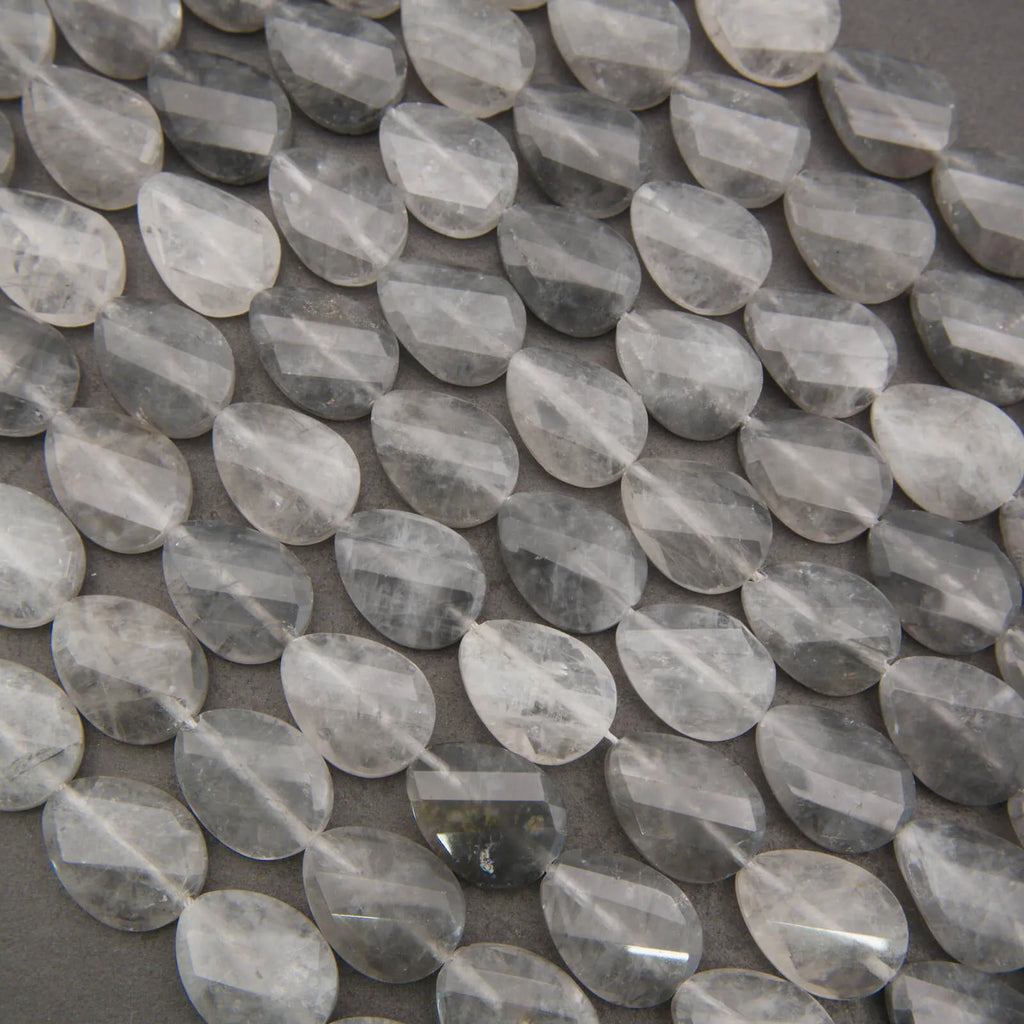 Cloudy clear twisted oval beads.