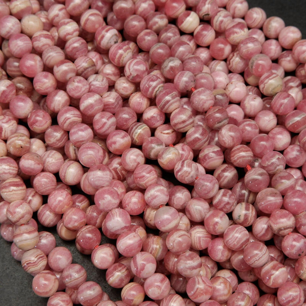 Rhodochrosite Beads With Pink and White Stripes.
