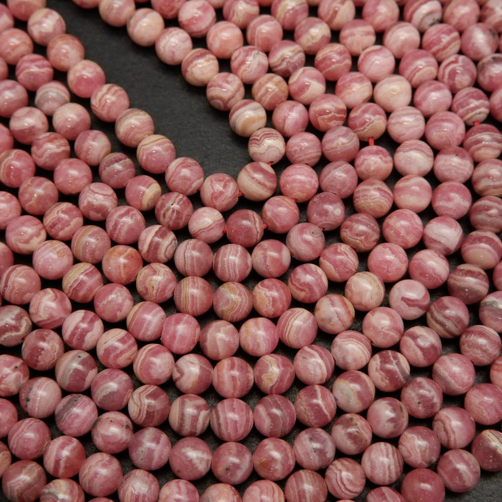 Rhodochrosite Beads With Pink and White Stripes.