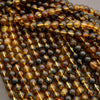 Close-up of amber and black beads on a string