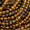 Close-up of amber-colored beads on a string