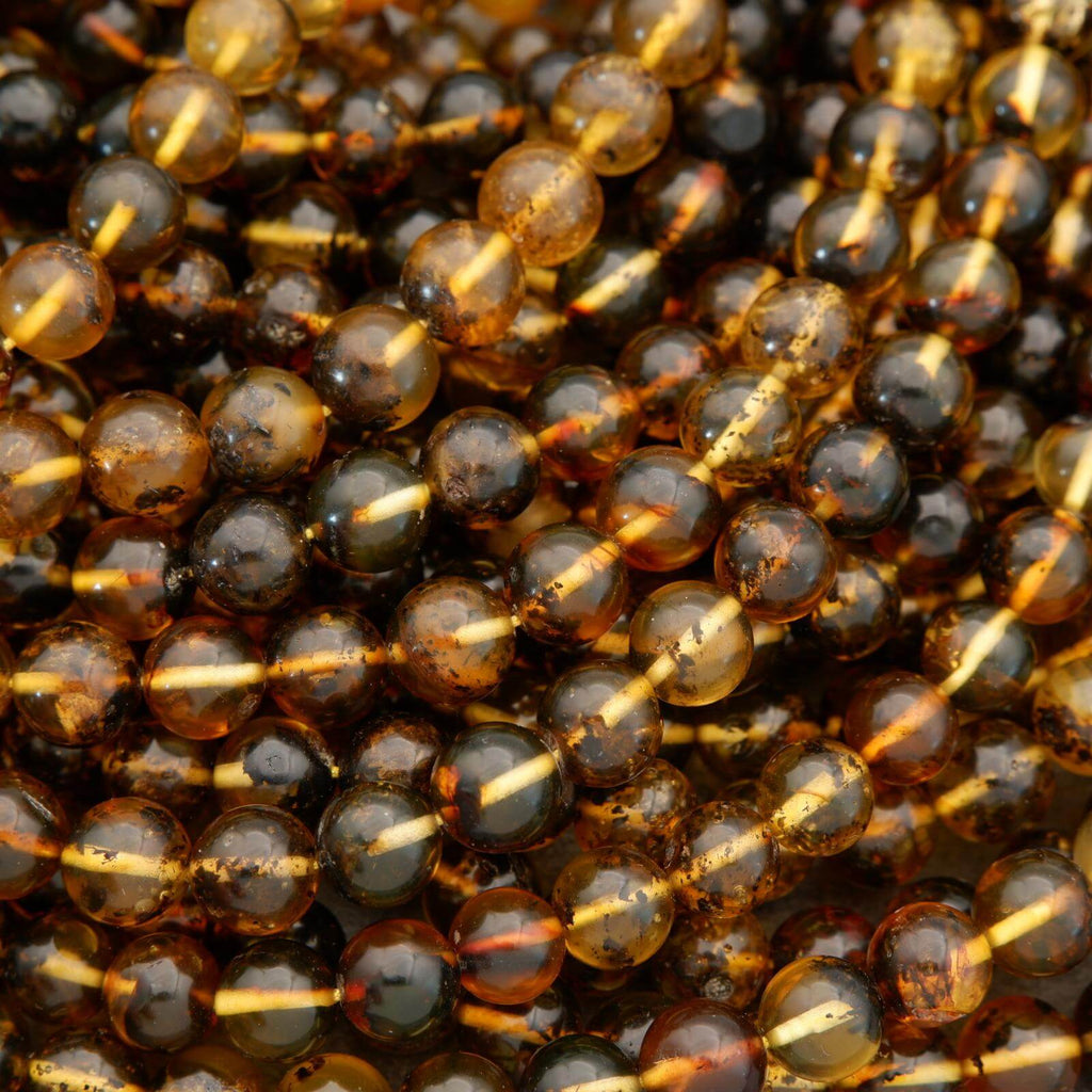 Close-up of amber-colored beads on a string