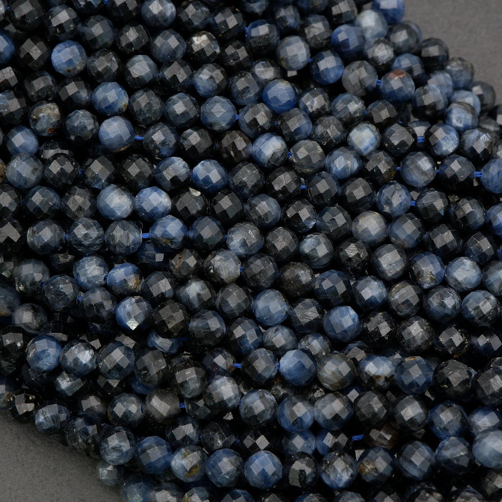 Dark blue kyanite beads showing deep navy and charcoal tones