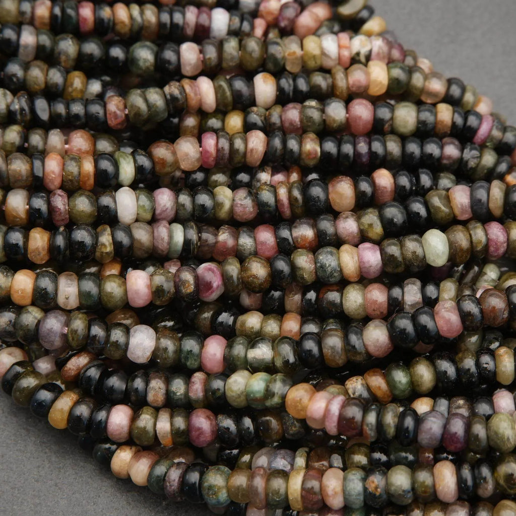 Close-up of multicolored beads on a gray background