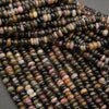 Close-up of multicolored beads on a gray background