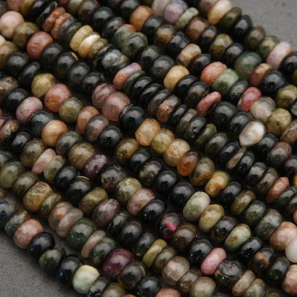 Close-up of multicolored beads on a gray surface