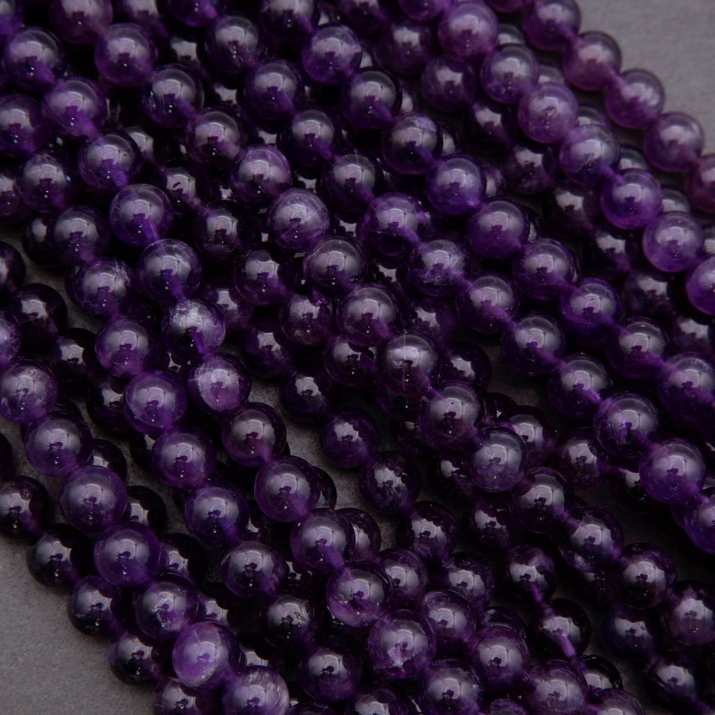 Close-up of purple beads on a gray background