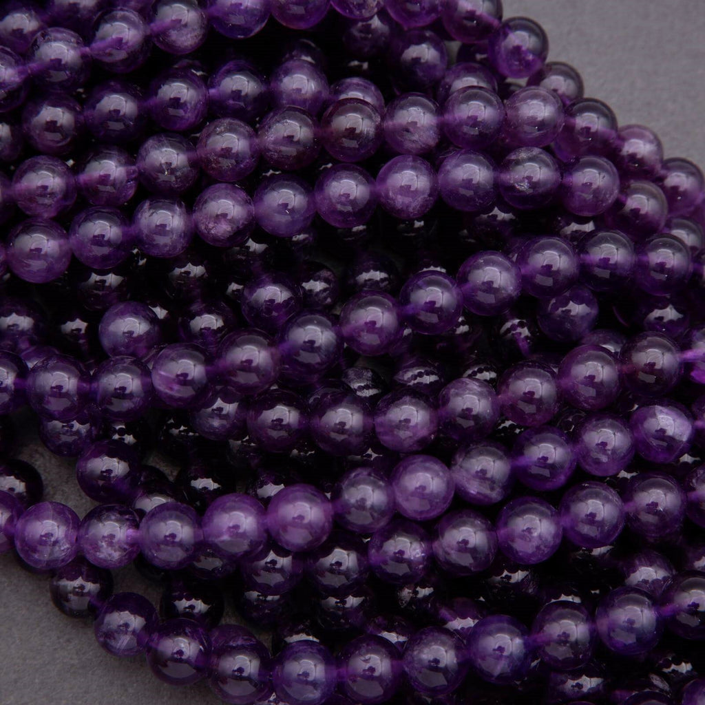 Close-up of purple beads on a gray background