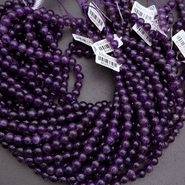 Purple beads with barcodes on a gray background