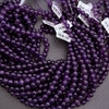 Purple beads with barcodes on a gray background
