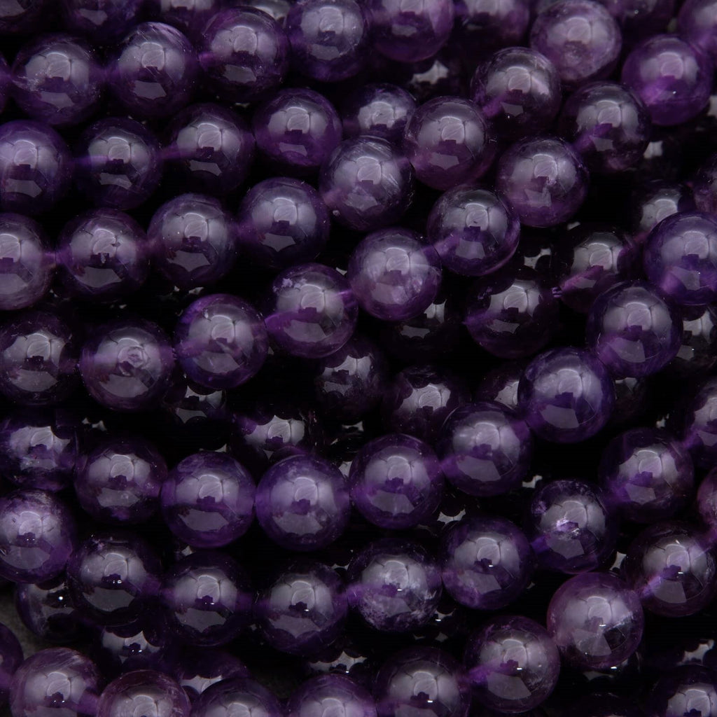 Close-up of purple beads on a dark background