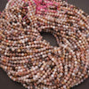 Close-up of multicolored bead string on a dark background