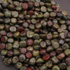 Close-up of a pile of multicolored stones on a dark background
