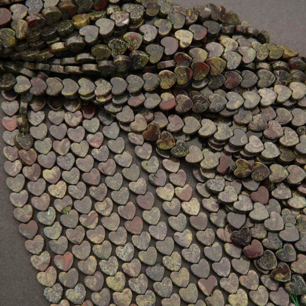 Close-up of a heart-shaped stone mosaic on a dark surface