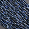 Close-up of blue beads on a gray surface