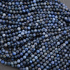 Close-up of blue beads on a dark background