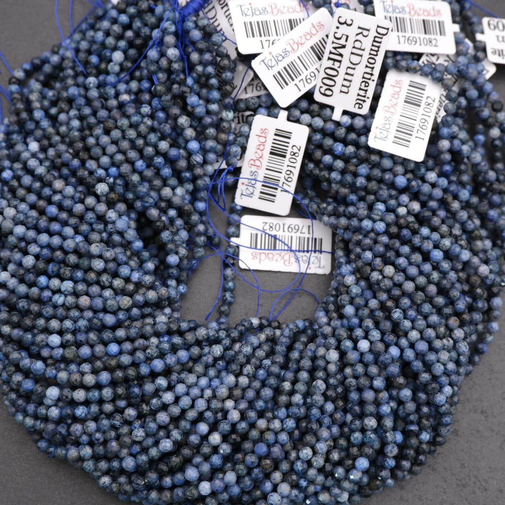 String of blue beads with price tags on a gray background