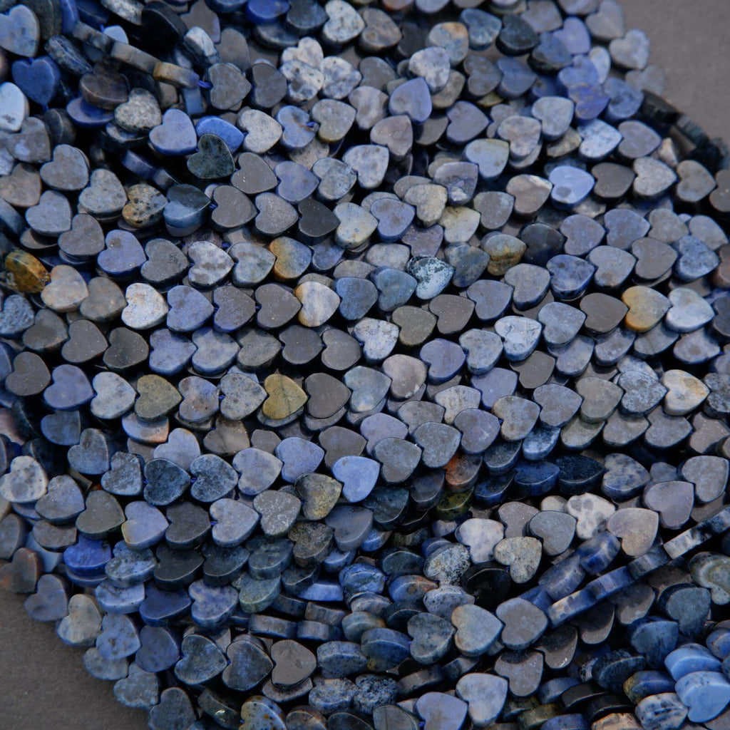 Close-up of a pile of blue heart-shaped stones.