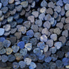 Close-up of heart-shaped stones in various shades of blue and gray.