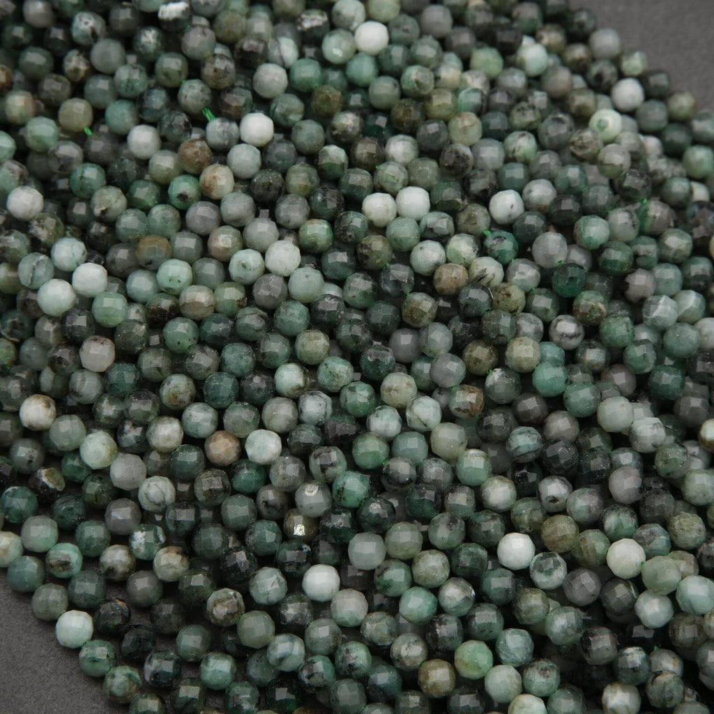 Close-up of green and white beads on a dark background