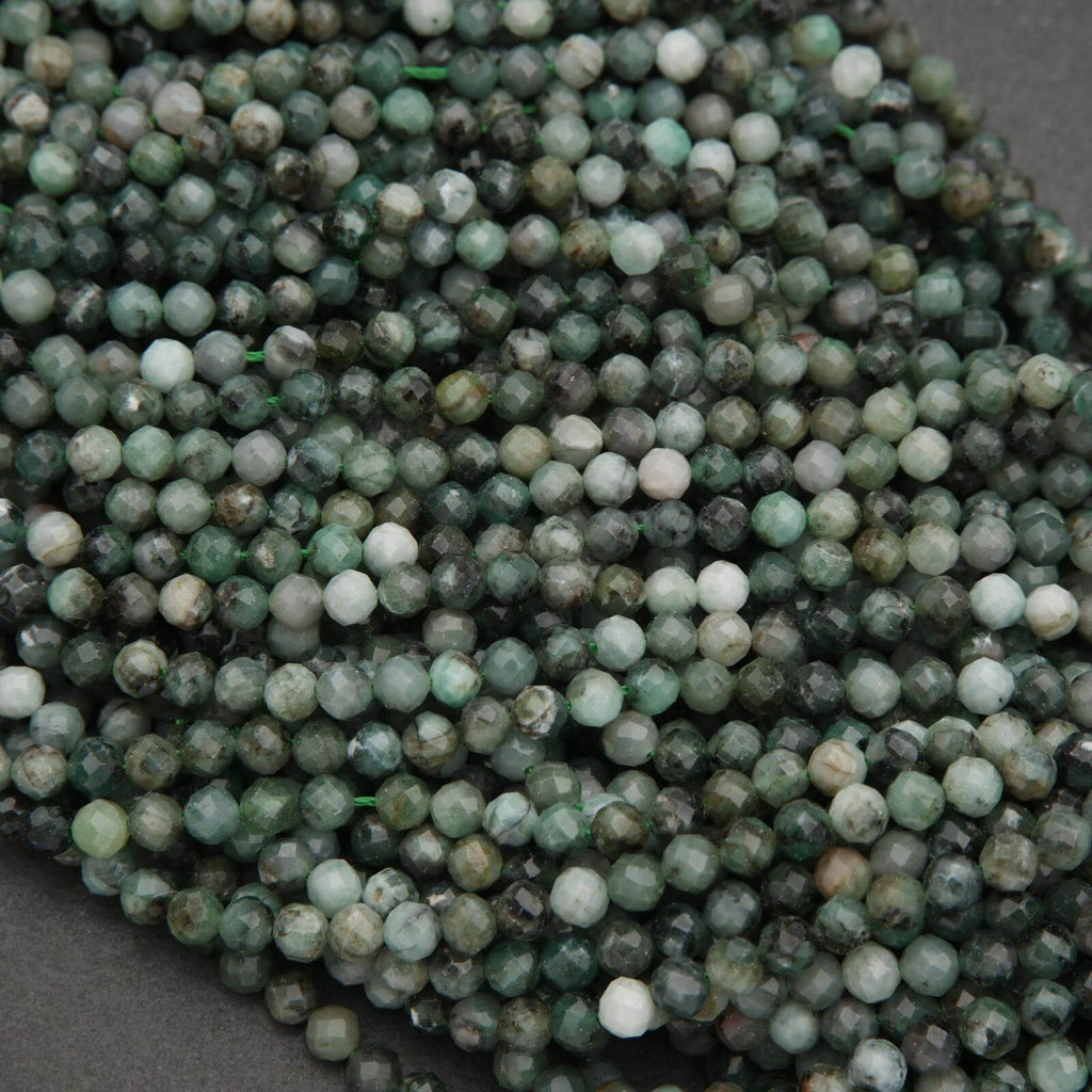 Close-up of green and white beads on a dark surface