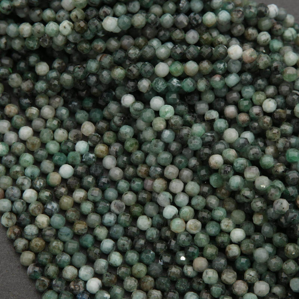 Close-up of green and white beads on a dark background