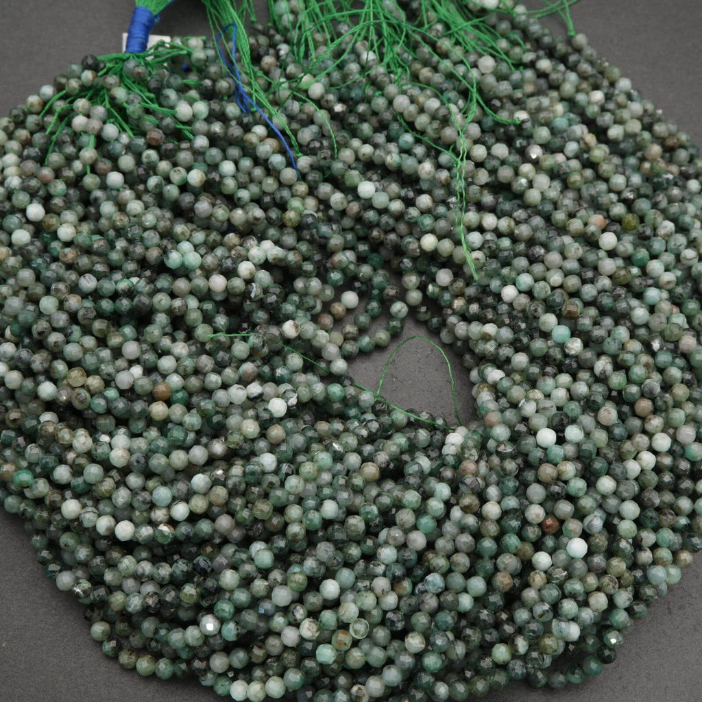 String of green beads on a dark surface