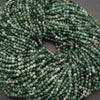 Close-up of a string of green beads on a dark background