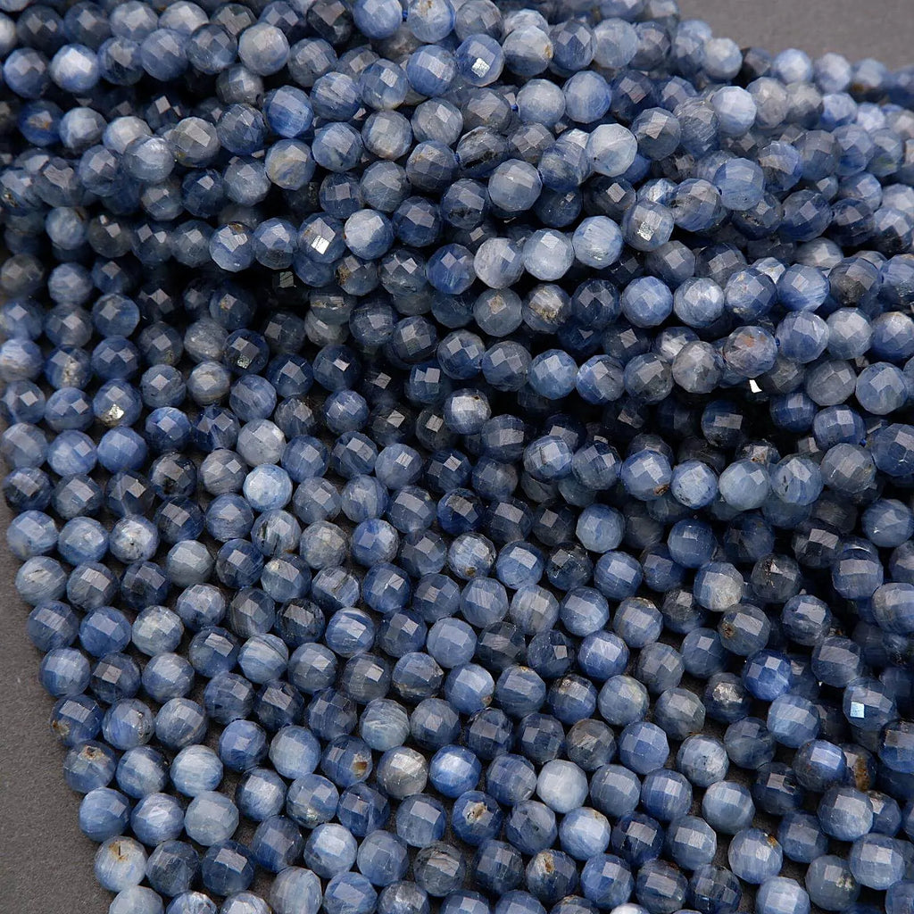 Close-up of blue faceted beads on a gray background