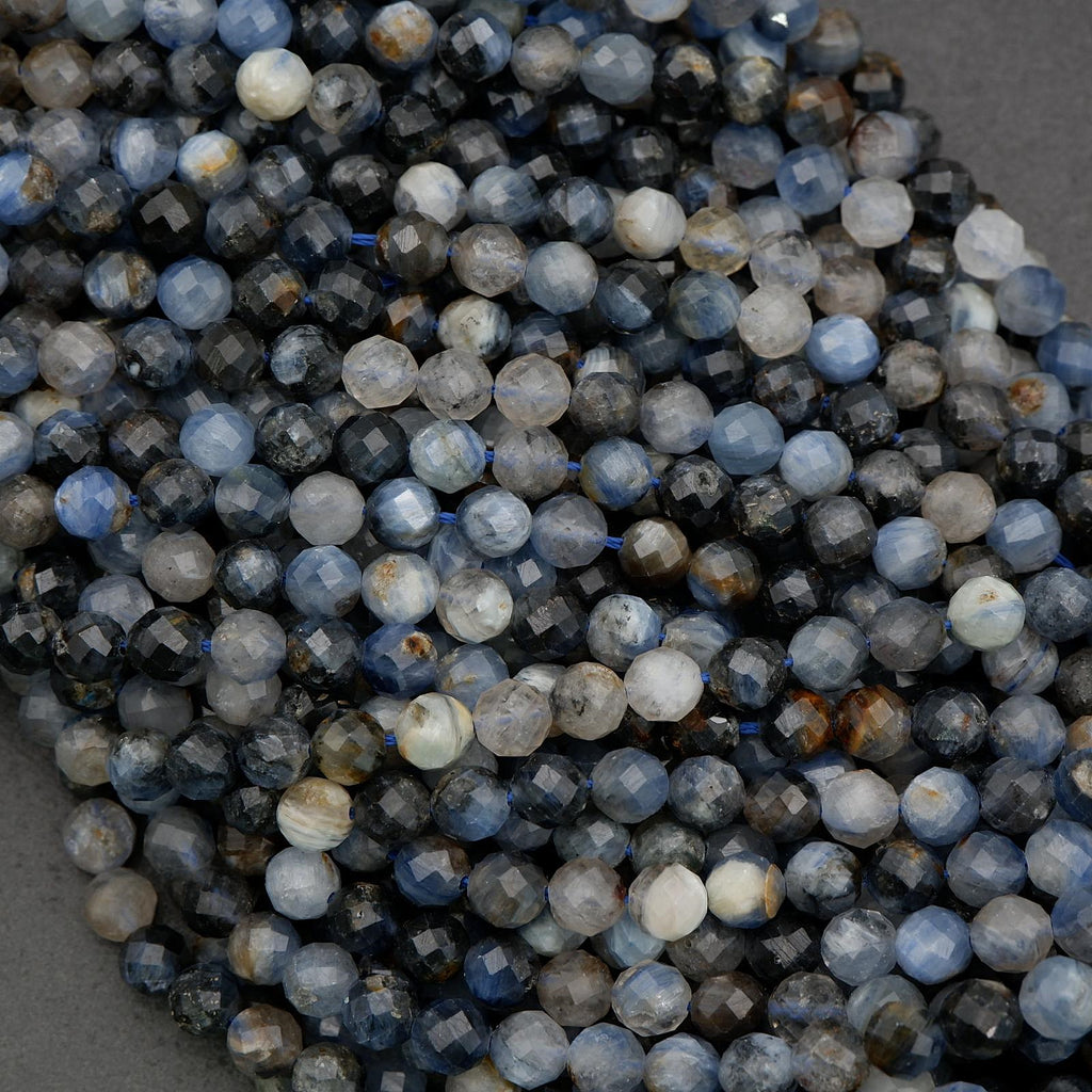 Faceted kyanite beads with organic color shifts and earthy inclusions