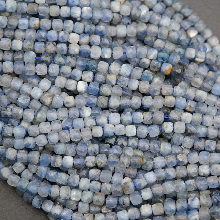 Close-up of faceted kyanite beads showing internal striations