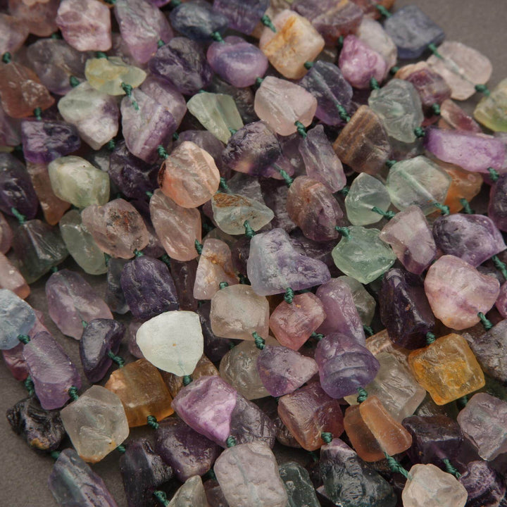 Close-up of multicolored gemstones on a gray background