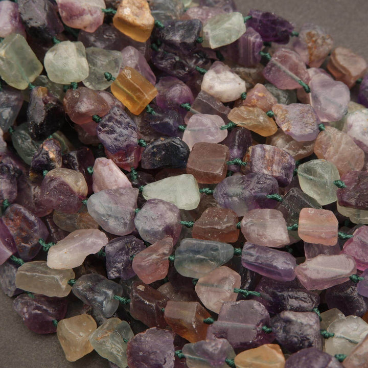 Close-up of multicolored gemstones on a string