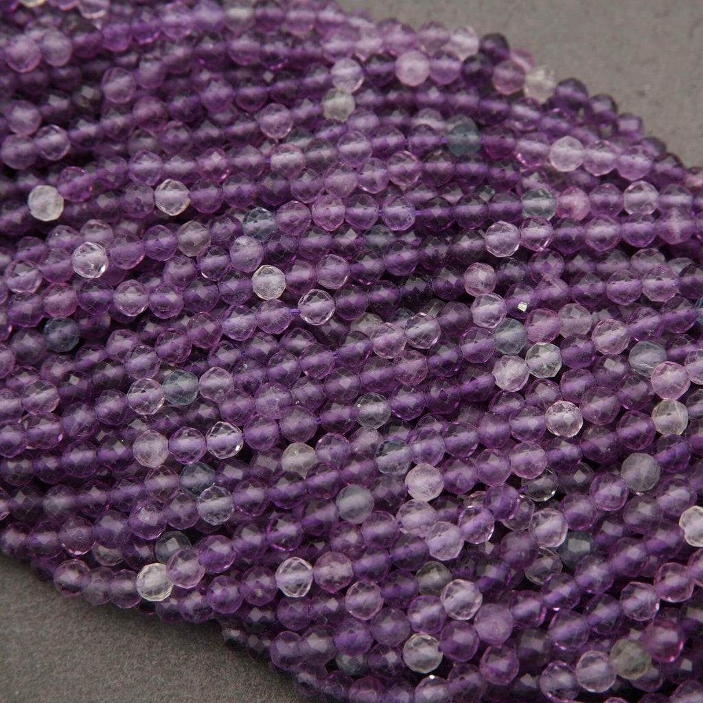 Close-up of purple beads on a gray background