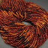 Orange hessonite garnet gradient beads.