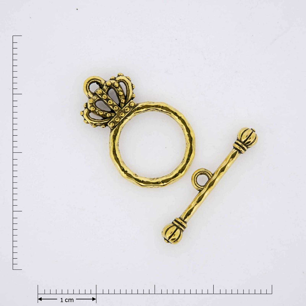 Gold crown toggle clasp.