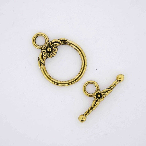 Gold jewelry findings toggle clasps.