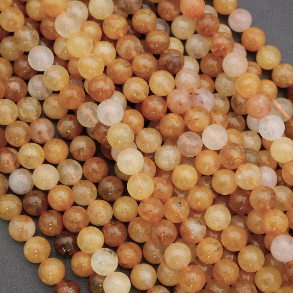 Close-up of multicolored round beads on a gray background