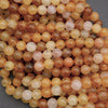 Close-up of multicolored round beads on a gray background