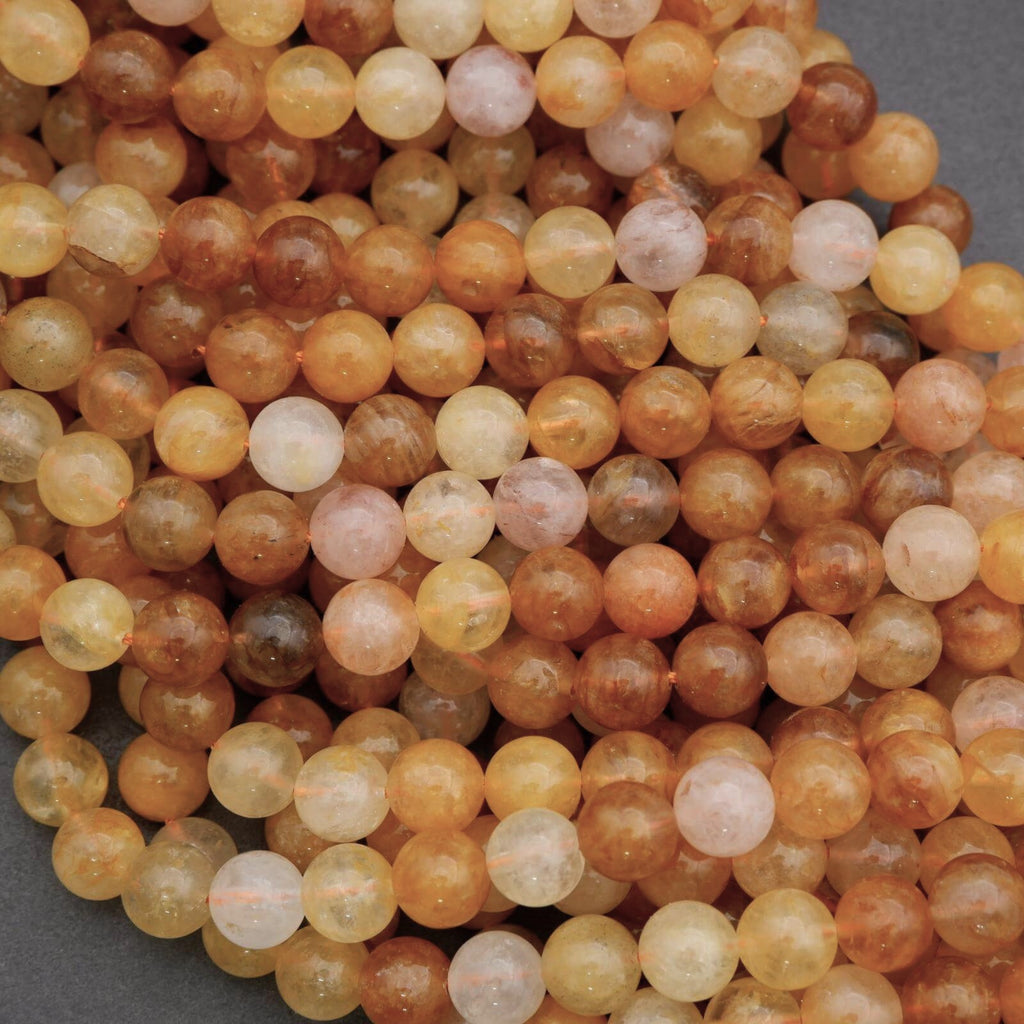 Close-up of multicolored round beads on a gray background