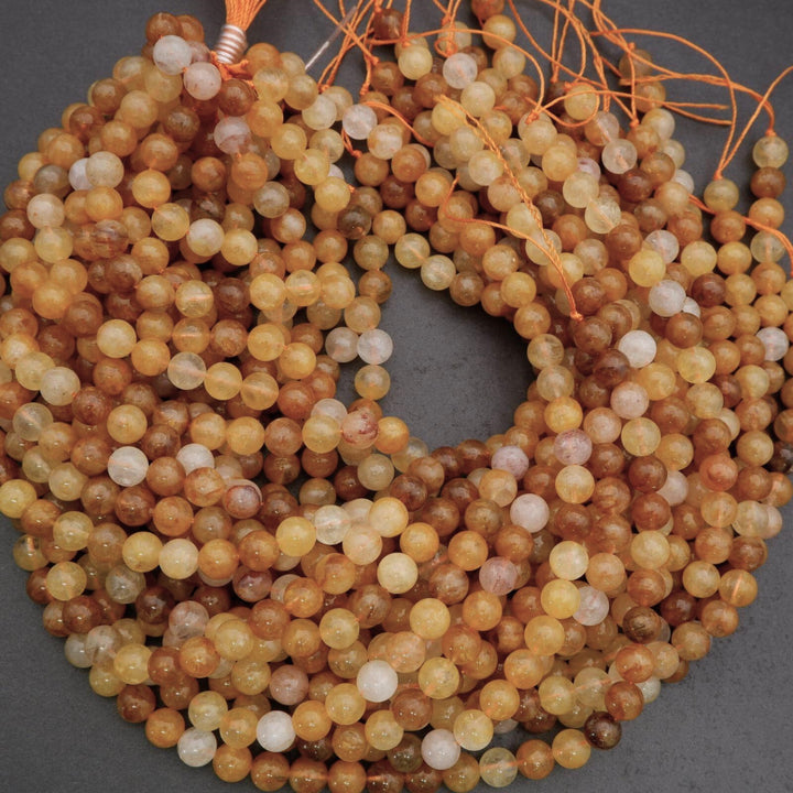 String of multicolored beads on a gray background