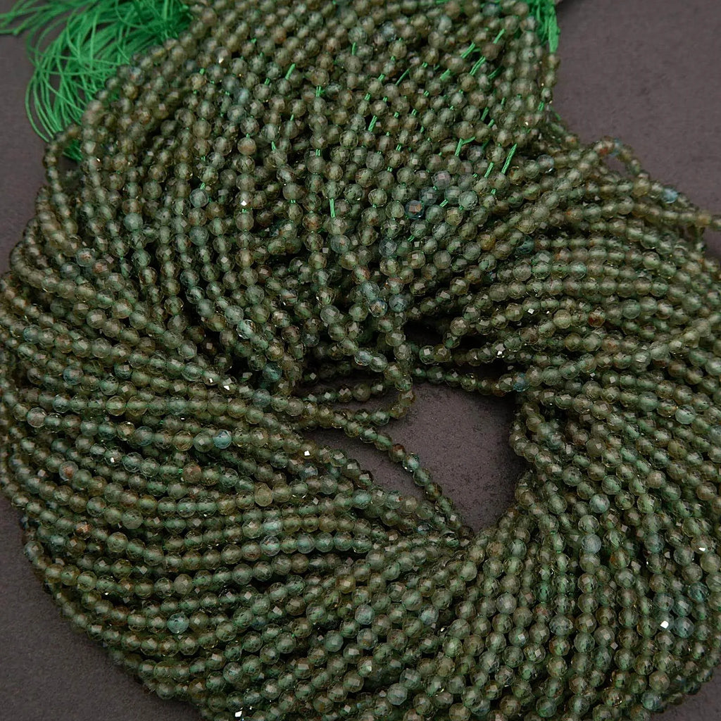 Green beaded scrunchie on a dark background