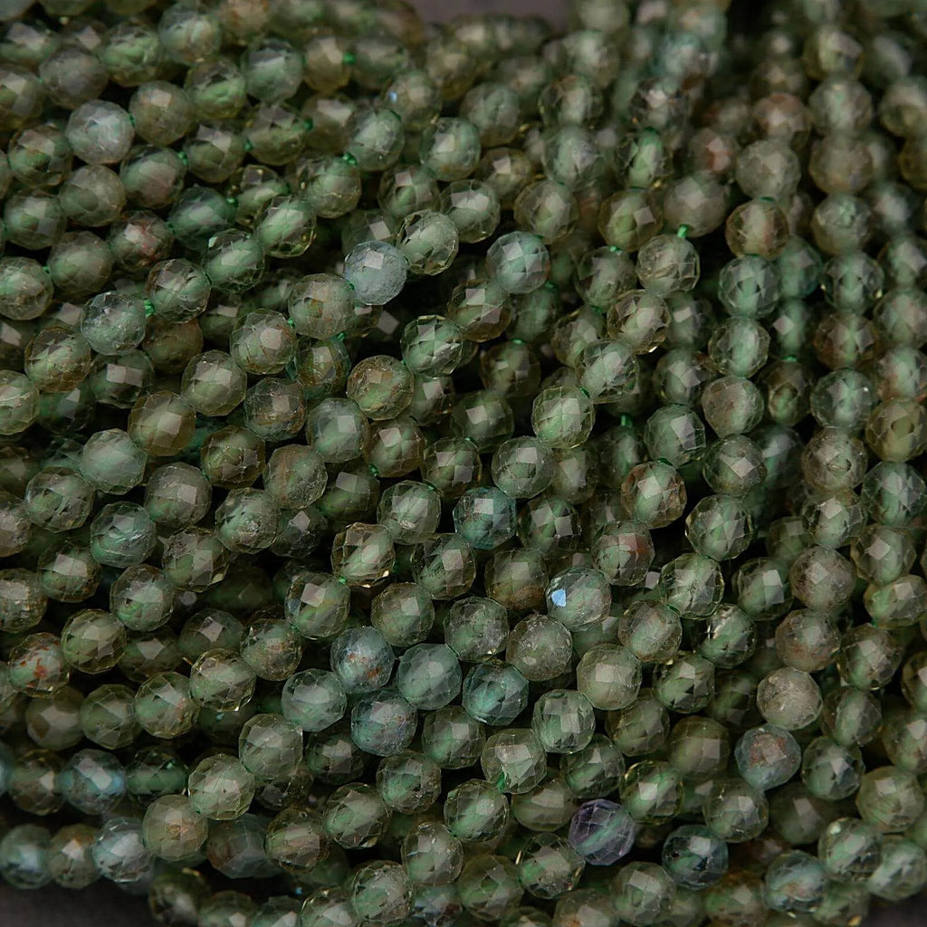 Close-up of green beads on a dark background
