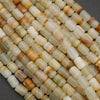 Barrel-shaped calcite beads in soft green, cream, and honey hues with subtle stripes
