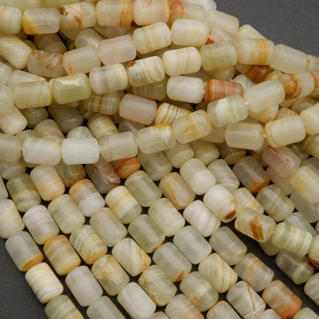 Striped calcite beads in pale green, beige, and golden tones for jewelry making