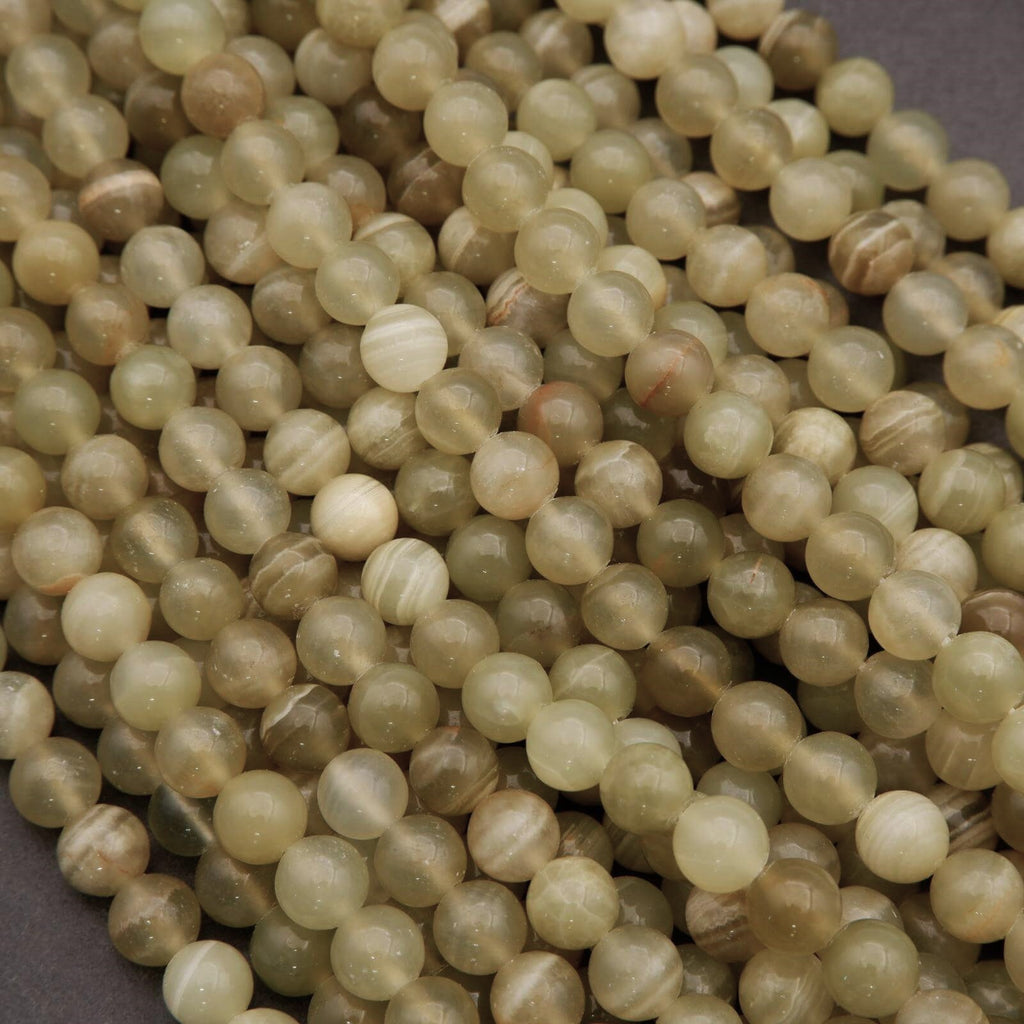 Close-up of beige beads on a dark background