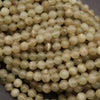 Close-up of a string of light-colored beads.